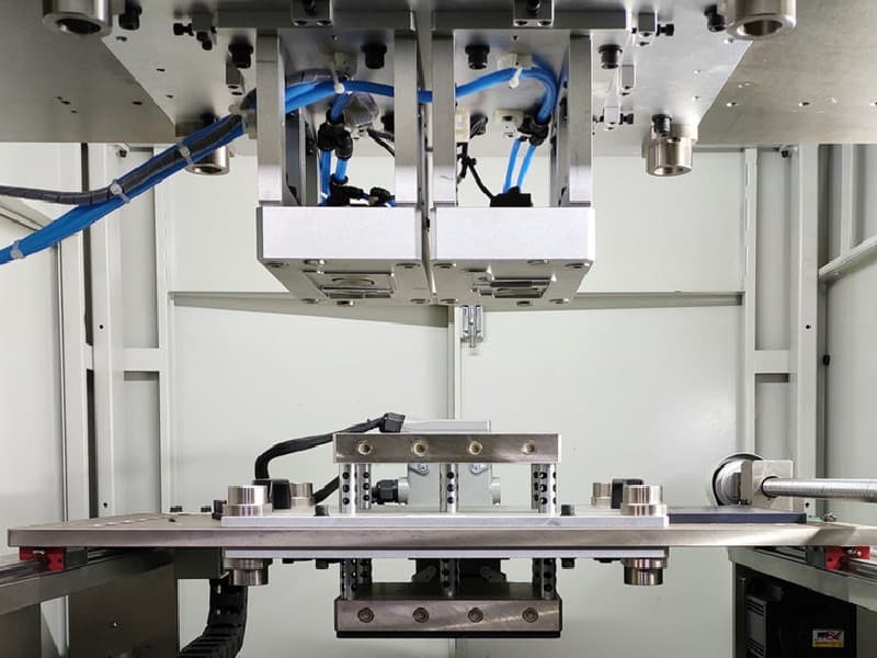 Facility interior — quality control process or machine operator, intimate shot, human presence visible